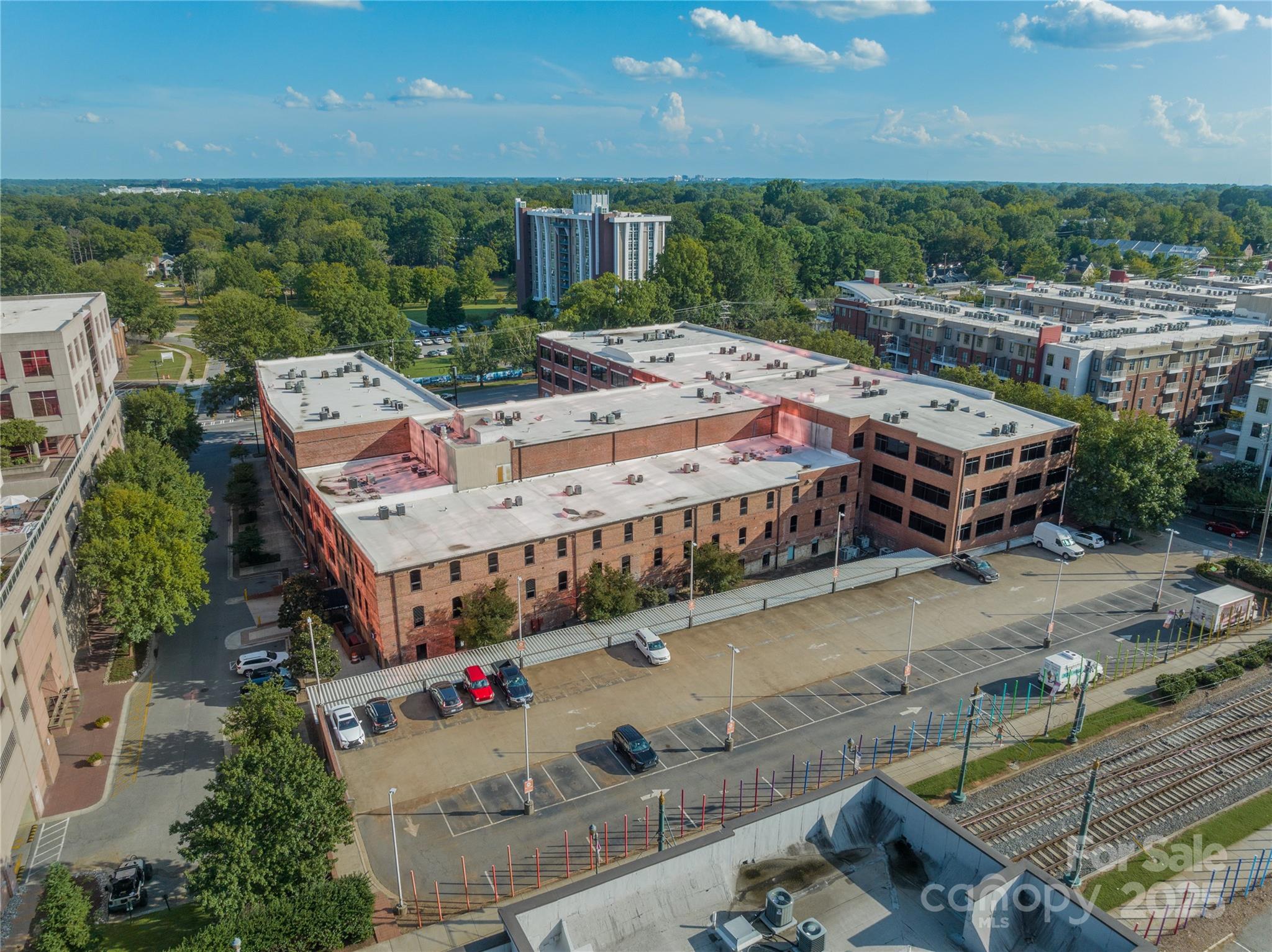 310 Arlington Avenue, Unit MULTIPLE Charlotte, NC 28203 - Photo 5 of 13 an aerial view of a house with a yard