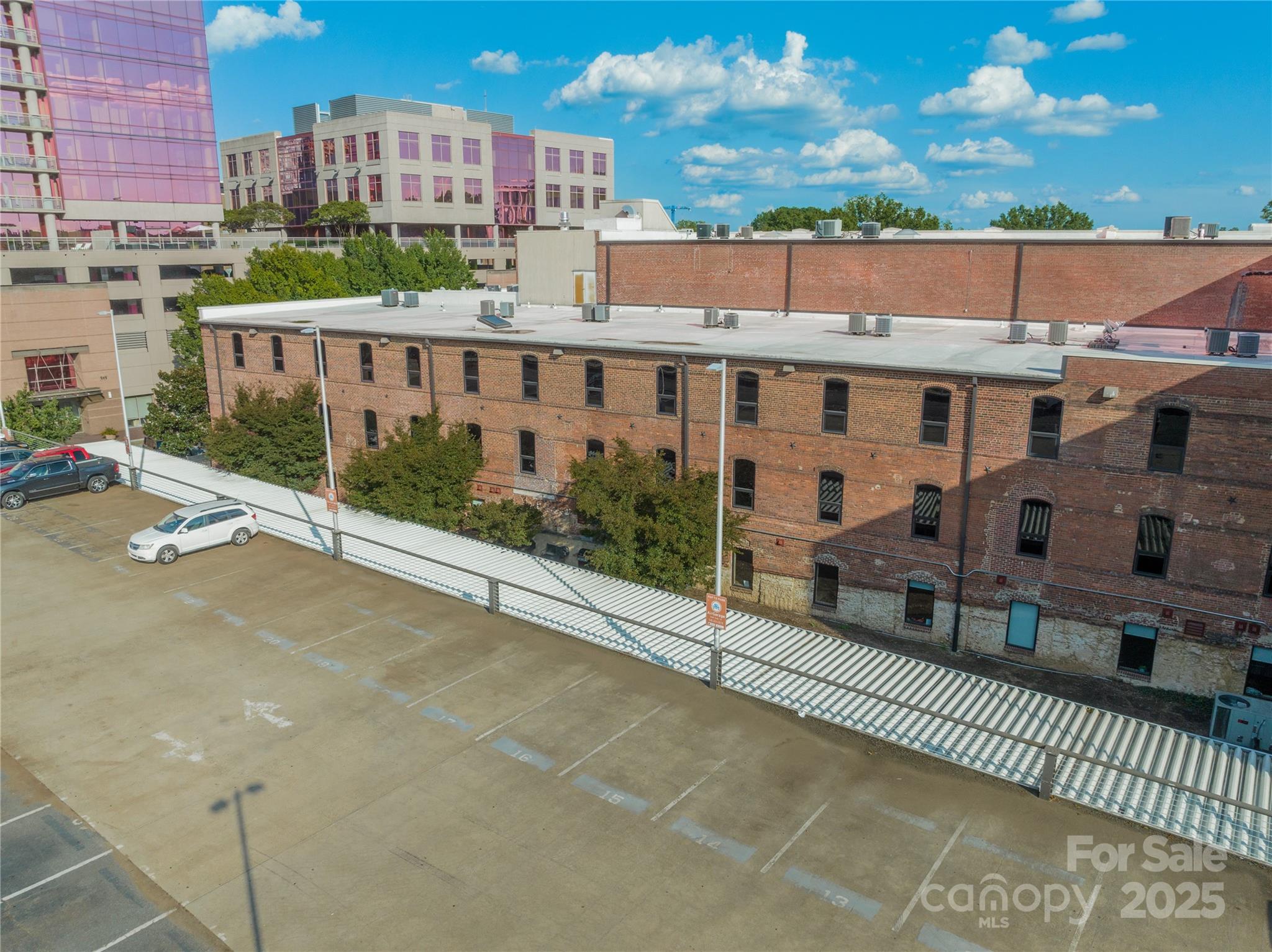 310 Arlington Avenue, Unit MULTIPLE Charlotte, NC 28203 - Photo 8 of 13 a view of a building from a balcony