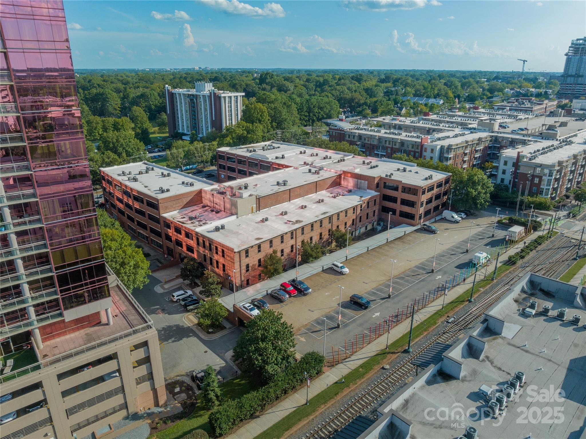 310 Arlington Avenue, Unit MULTIPLE Charlotte, NC 28203 - Photo 10 of 13 an aerial view of a house with a big yard