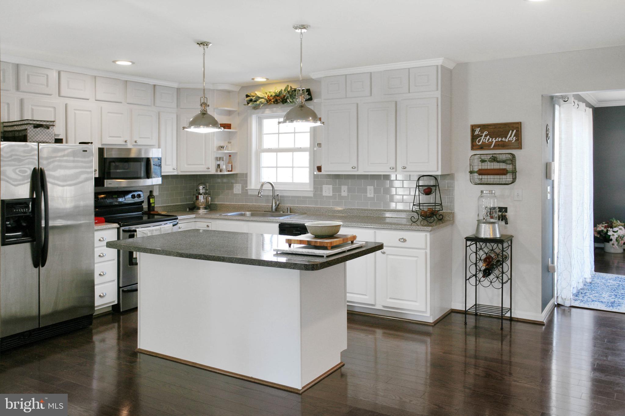 92 Quarry Road Stafford, VA 22554 - Photo 11 of 52 Bright, white open kitchen with island