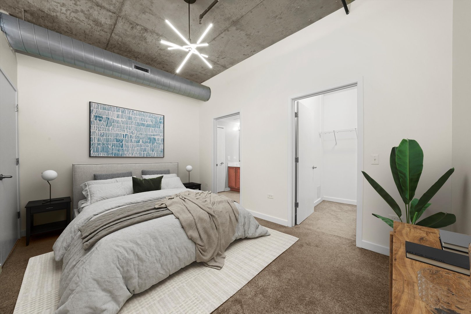 50 East 16th Street, Unit 414 Chicago, IL 60616 - Photo 15 of 26 a spacious bedroom with a bed and a painting on the wall