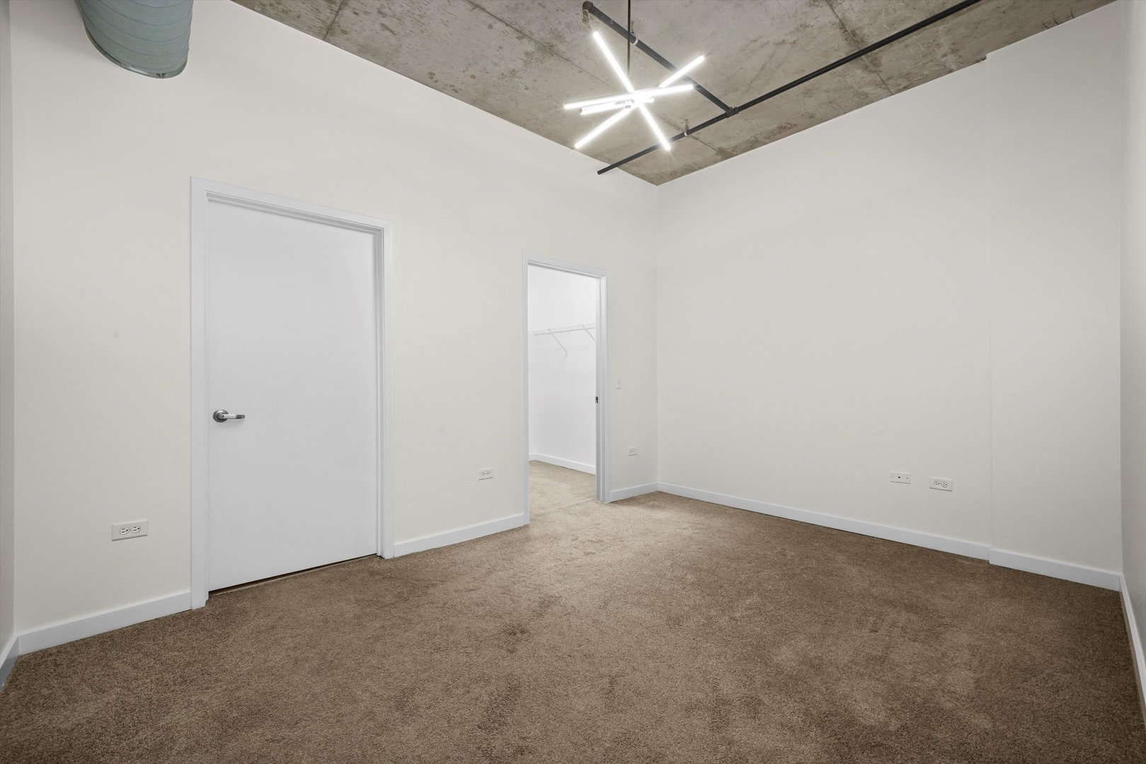 50 East 16th Street, Unit 414 Chicago, IL 60616 - Photo 17 of 26 an empty room with ceiling fan and window