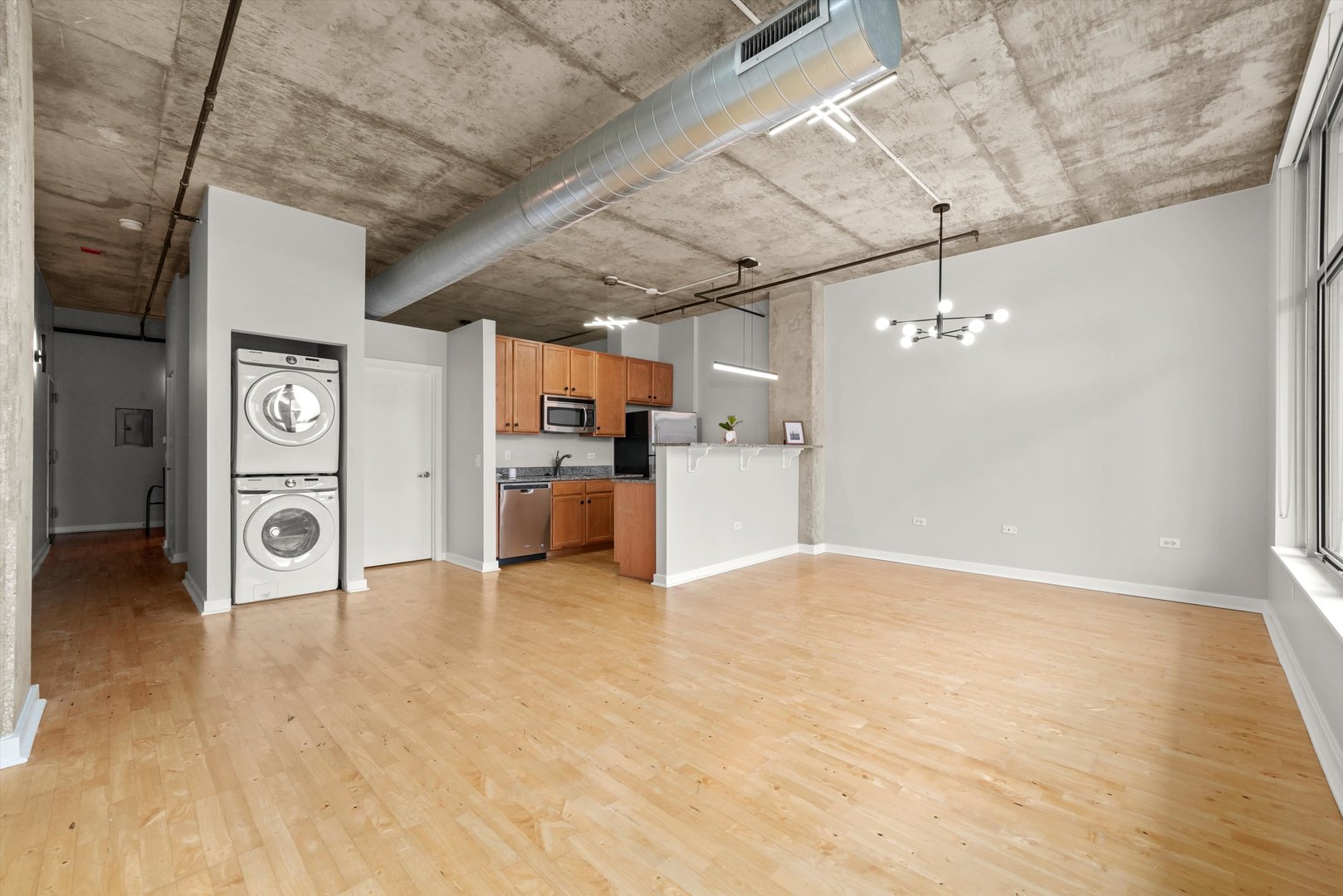 50 East 16th Street, Unit 414 Chicago, IL 60616 - Photo 7 of 26 a view of a kitchen with a sink and a refrigerator