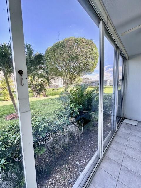 338 Fanshaw I Boca Raton, FL 33434 - Photo 8 of 28 a view of a porch with furniture and a yard