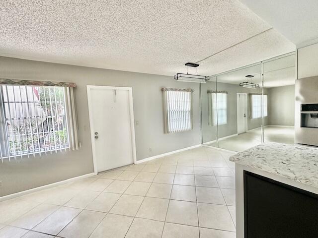 338 Fanshaw I Boca Raton, FL 33434 - Photo 28 of 28 a view of an empty room with glass door