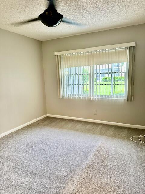 338 Fanshaw I Boca Raton, FL 33434 - Photo 4 of 28 a view of an empty room with a window