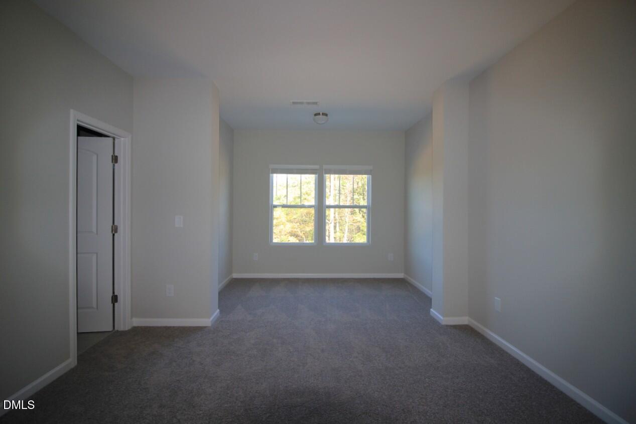 349 Great Northern Station Apex, NC 27502 - Photo 11 of 20 an empty room with a window