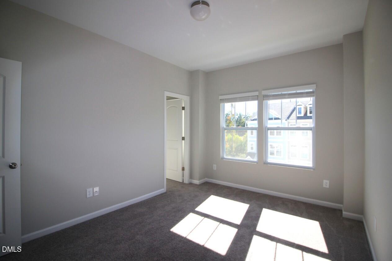 349 Great Northern Station Apex, NC 27502 - Photo 14 of 20 an empty room with a window