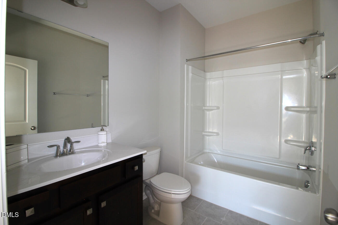 349 Great Northern Station Apex, NC 27502 - Photo 15 of 20 a bathroom with a sink toilet tub and shower