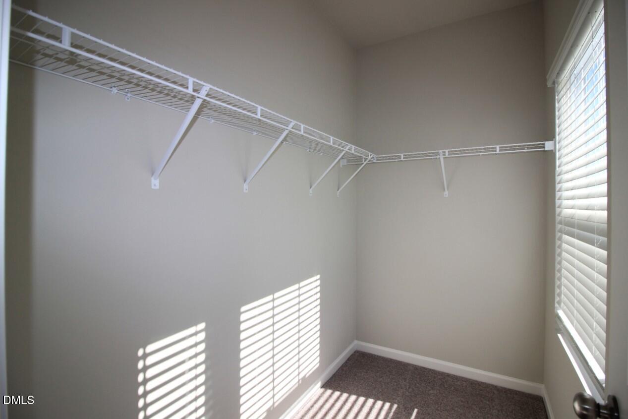 349 Great Northern Station Apex, NC 27502 - Photo 16 of 20 a view of a room with a window and wooden floor