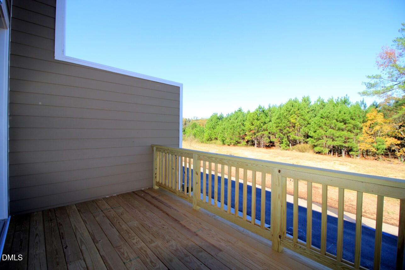 349 Great Northern Station Apex, NC 27502 - Photo 18 of 20 a view of a balcony with wooden floor