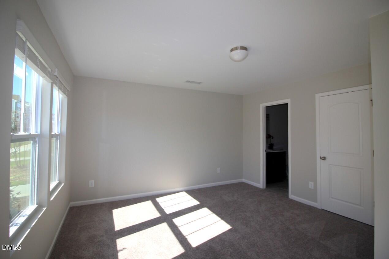 349 Great Northern Station Apex, NC 27502 - Photo 4 of 20 a view of an empty room and window