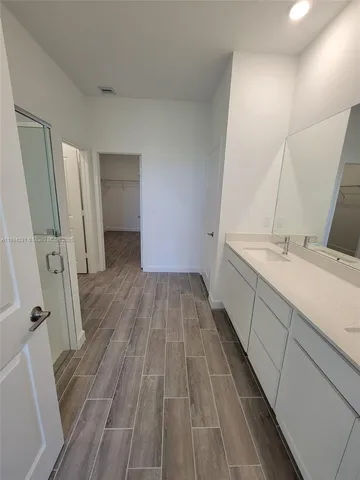 a bathroom with sink a vanity and a toilet