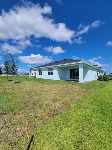 a view of house with yard