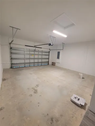 an empty room with stairs and a couch