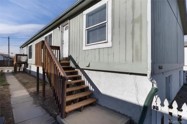a view of entryway with workspace and stairs