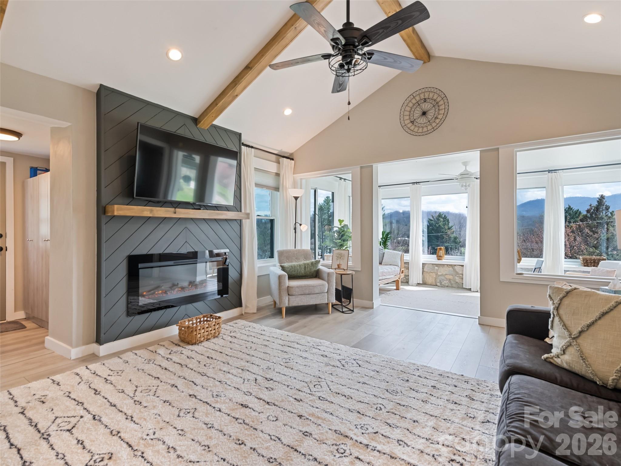 659 Golf Course Road Waynesville, NC 28786 - Photo 13 of 34 a living room with furniture and a fireplace
