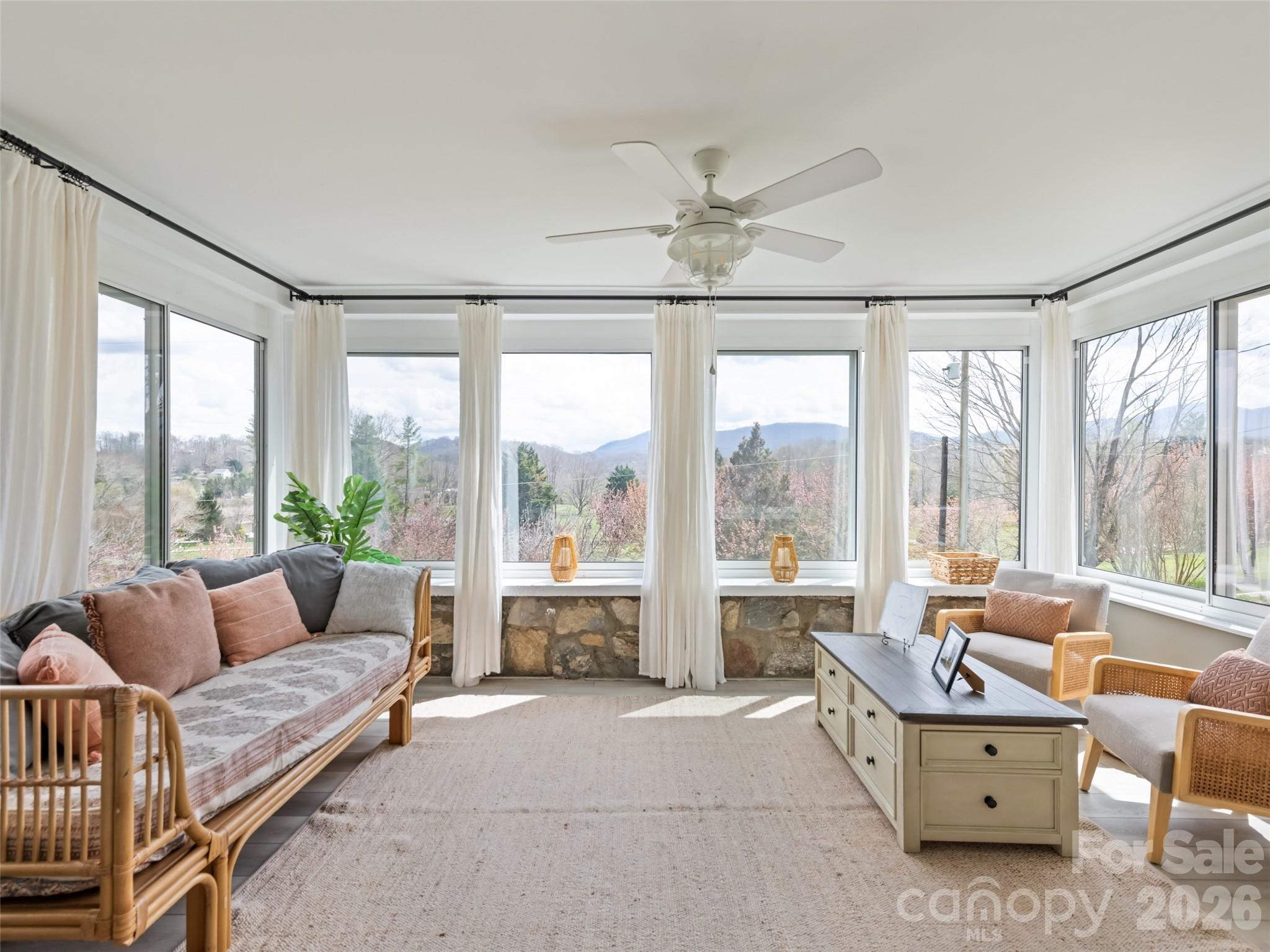 659 Golf Course Road Waynesville, NC 28786 - Photo 19 of 34 a living room with furniture and large windows