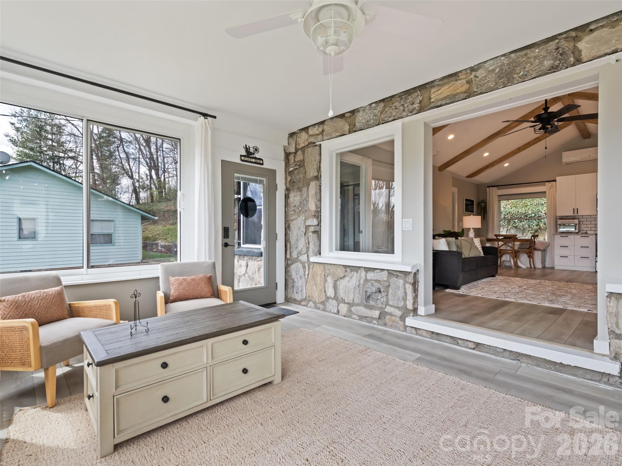 659 Golf Course Road Waynesville, NC 28786 - Photo 21 of 34 a spacious bathroom with a granite countertop tub and a large mirror next to a window