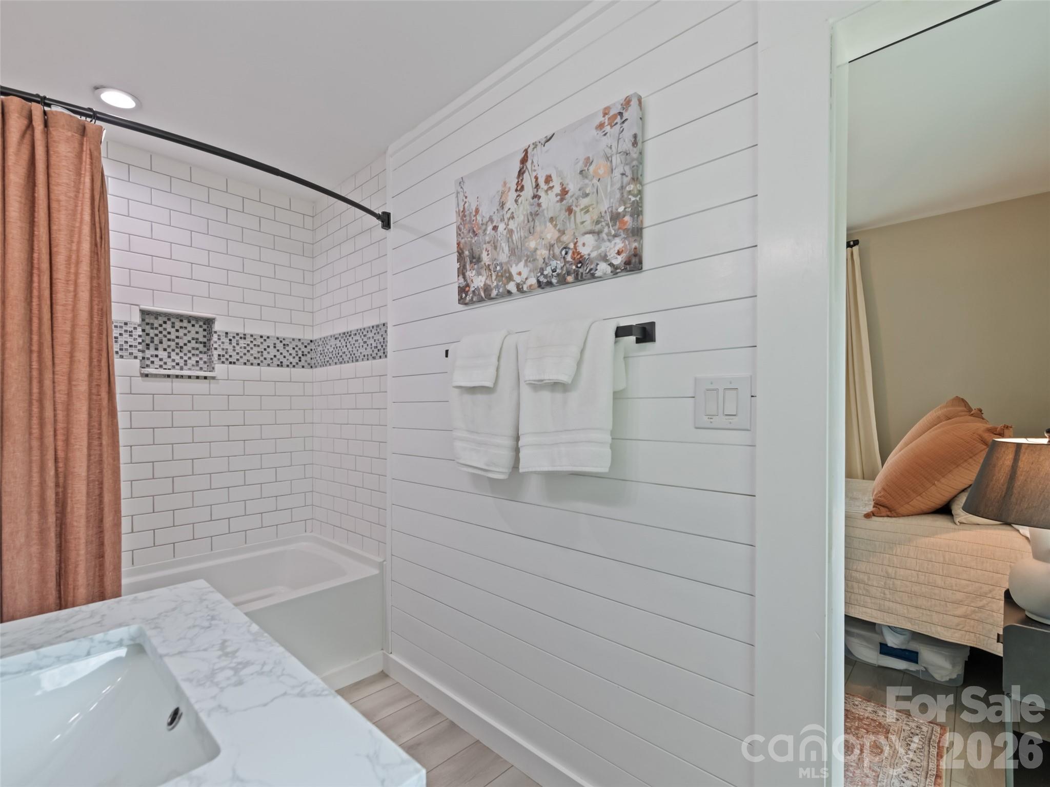 659 Golf Course Road Waynesville, NC 28786 - Photo 25 of 34 a bathroom with a bathtub and shower