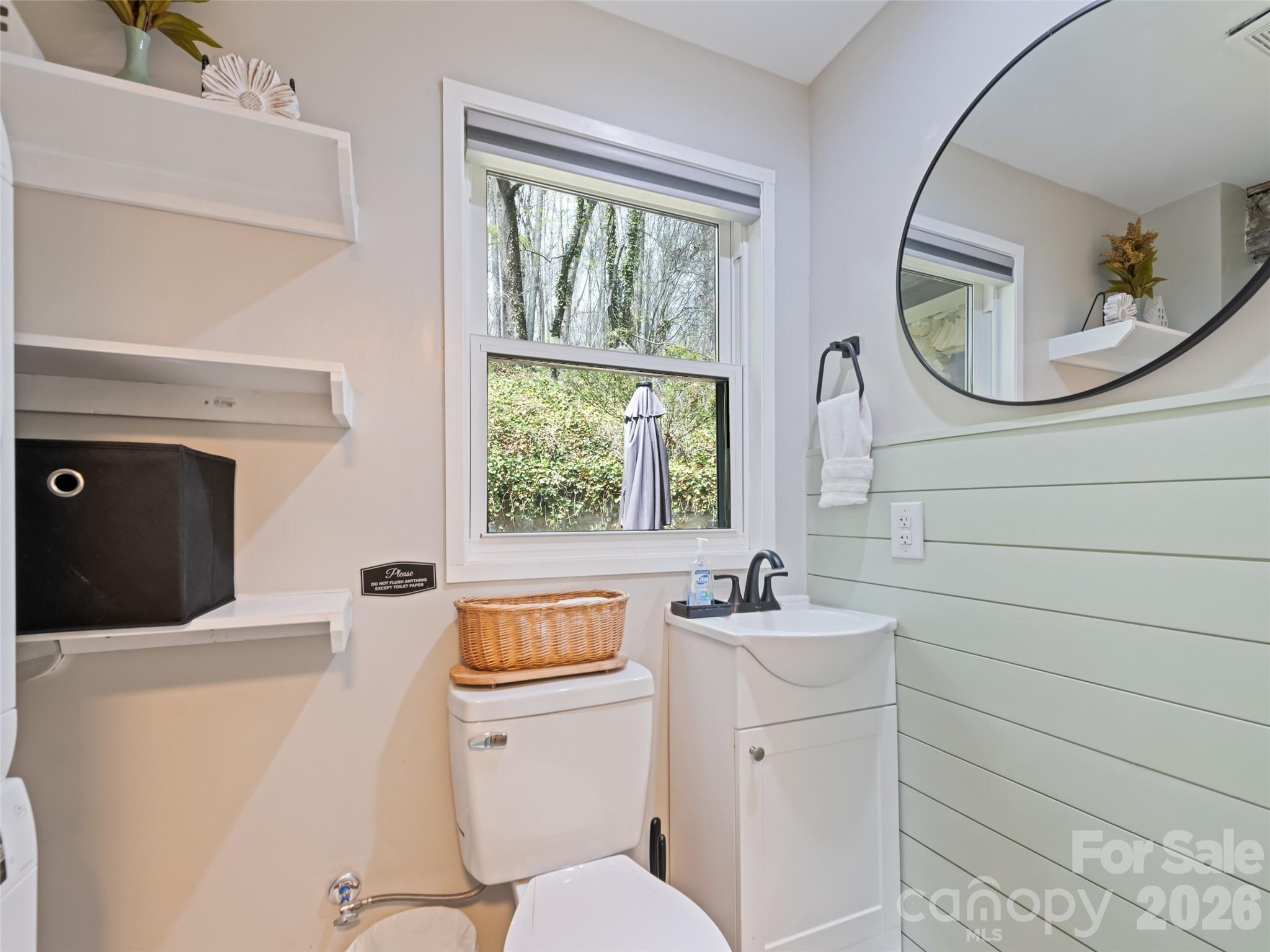 659 Golf Course Road Waynesville, NC 28786 - Photo 28 of 34 a bathroom with a sink mirror and toilet