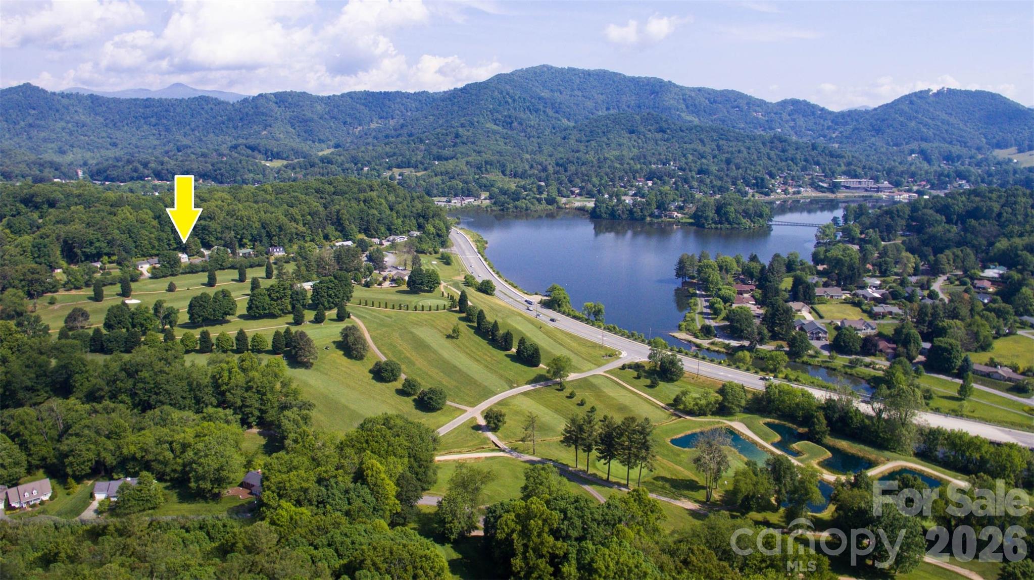 659 Golf Course Road Waynesville, NC 28786 - Photo 3 of 34 an aerial view of a house with mountain view