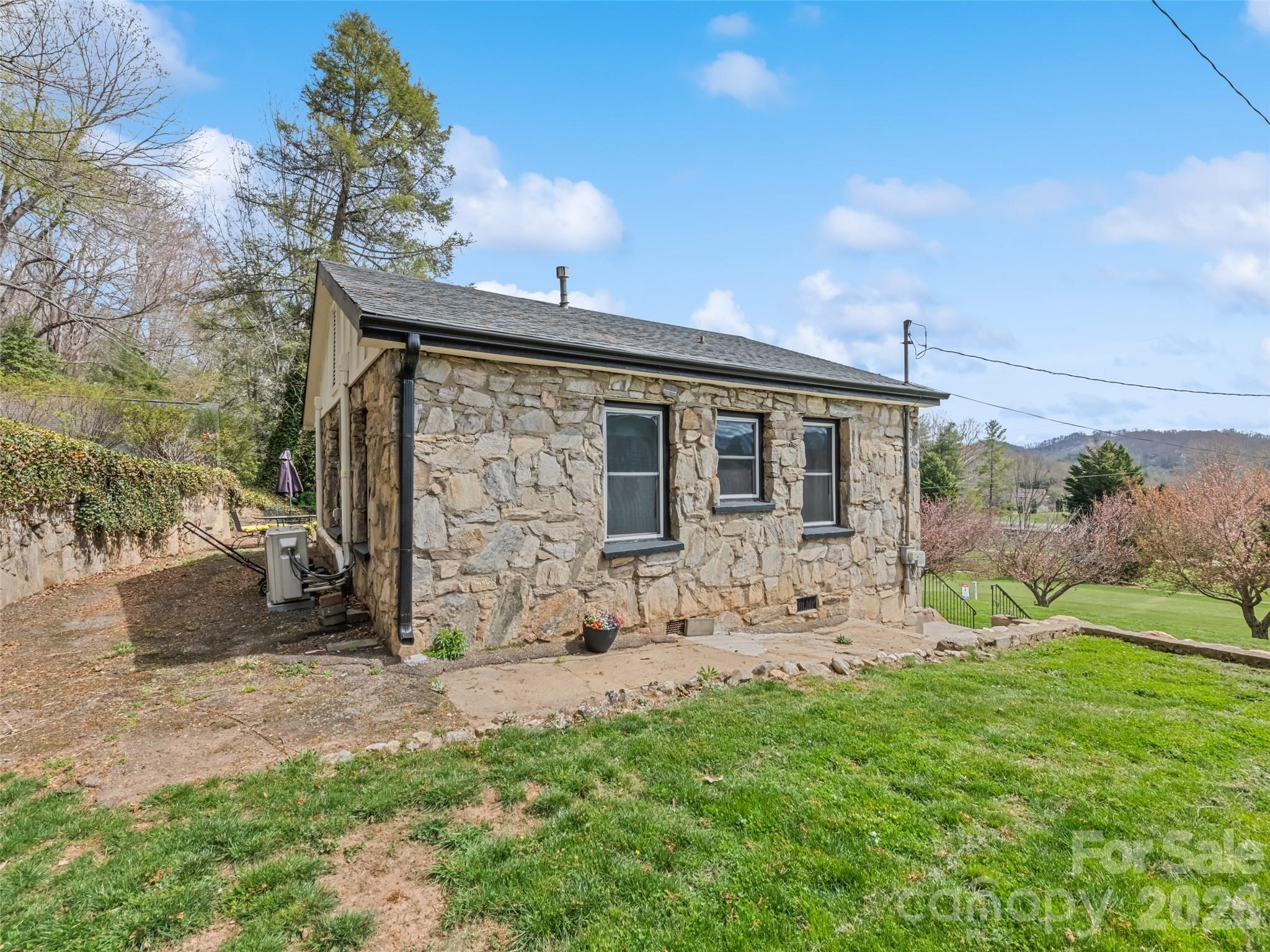 659 Golf Course Road Waynesville, NC 28786 - Photo 32 of 34 a view of a house with backyard