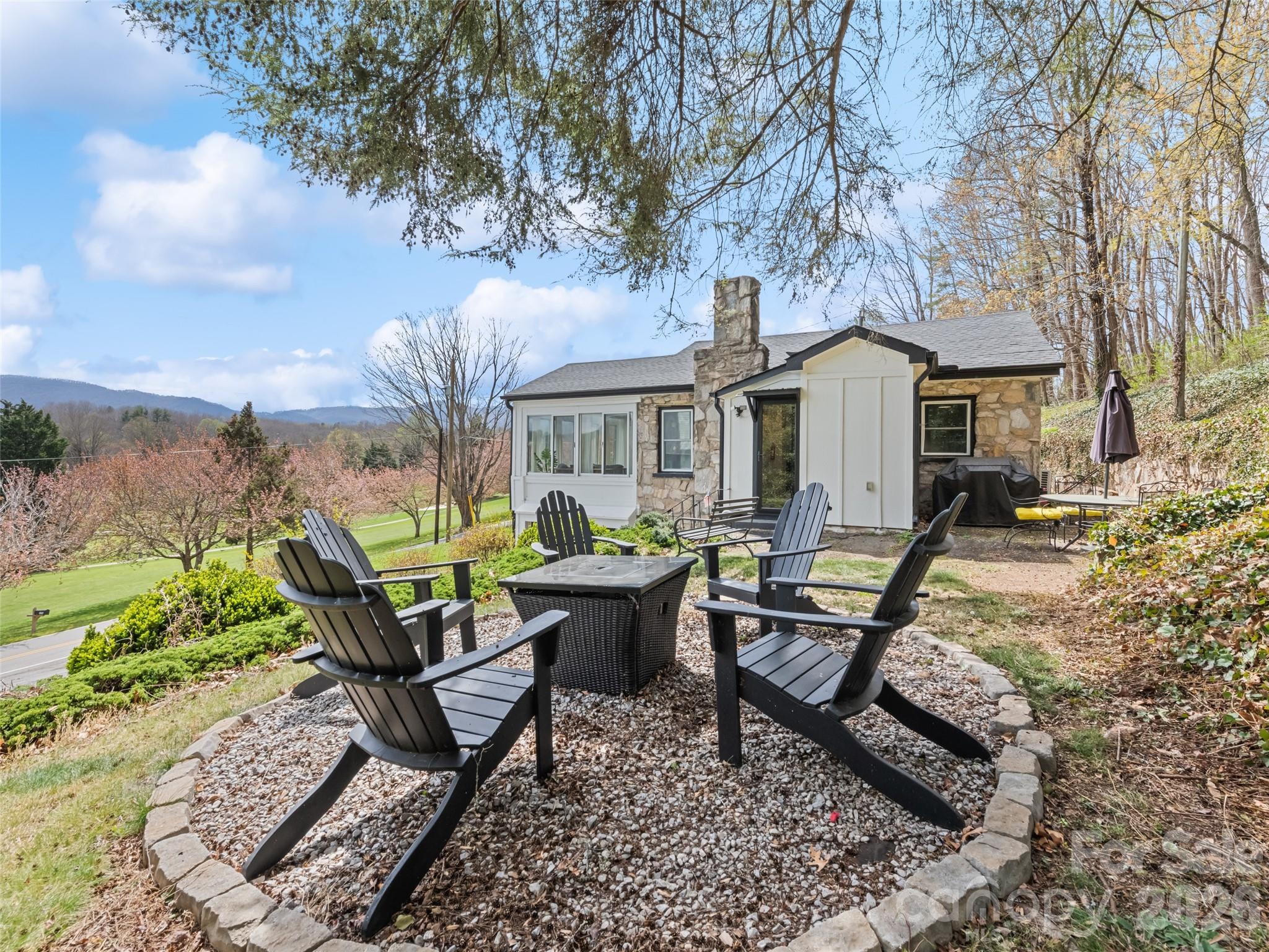 659 Golf Course Road Waynesville, NC 28786 - Photo 7 of 34 a view of a house with backyard and sitting area