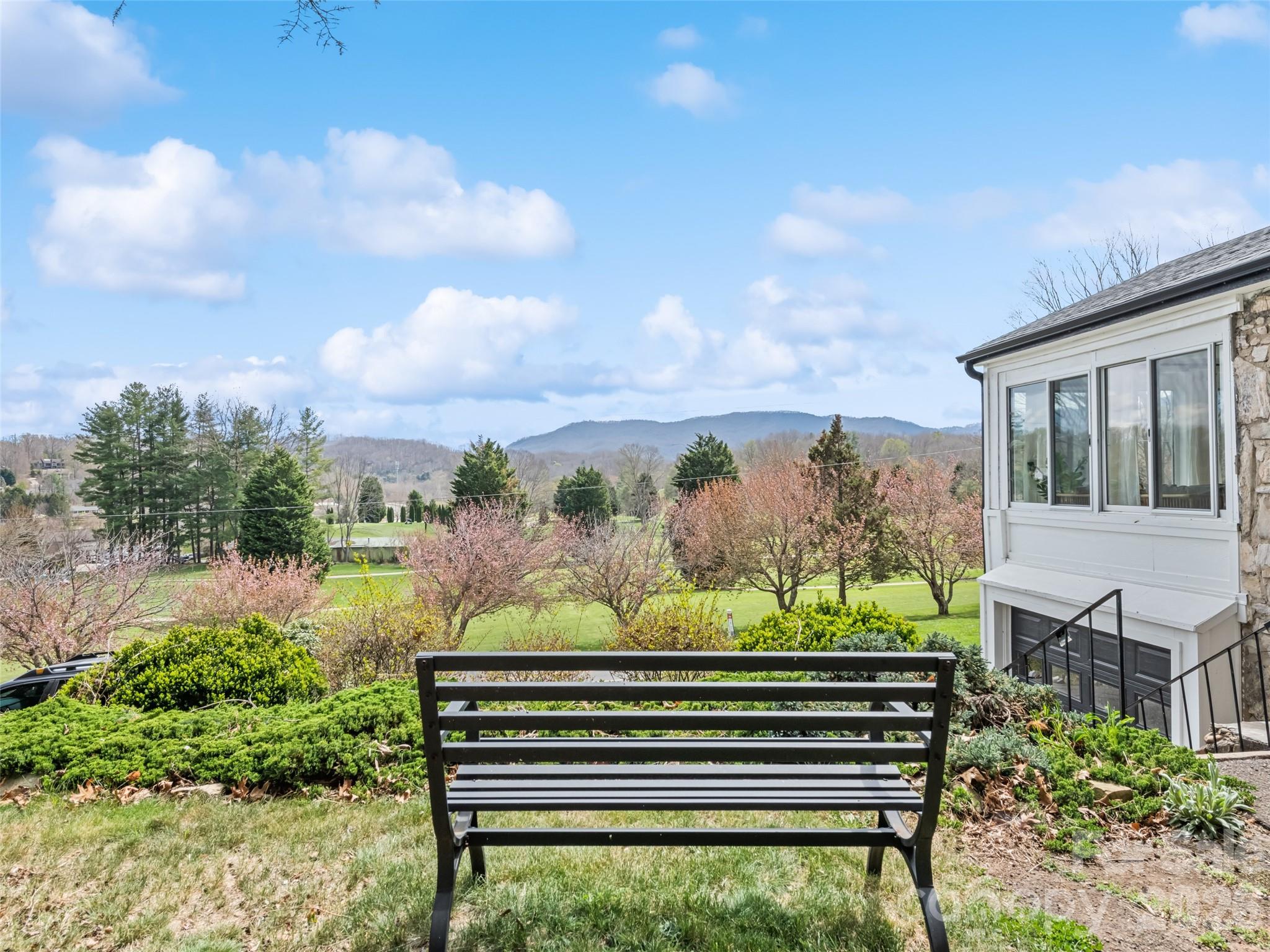 659 Golf Course Road Waynesville, NC 28786 - Photo 8 of 34 a view of a bench in the backyard
