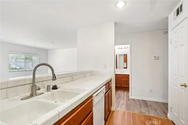 a sink with a faucet and appliances