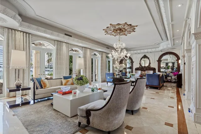 a living room with furniture potted plant and a large mirror