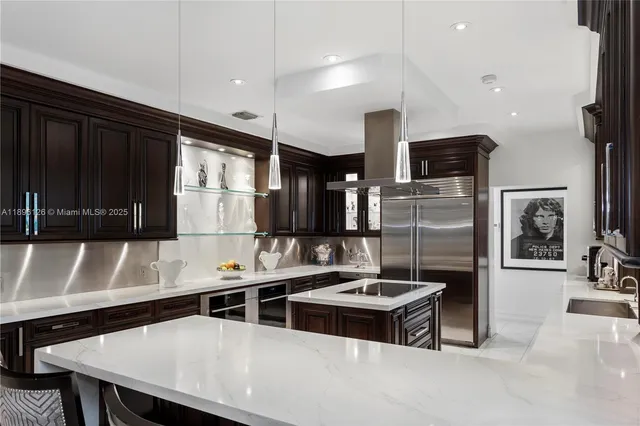 a kitchen with a sink and a stove top oven