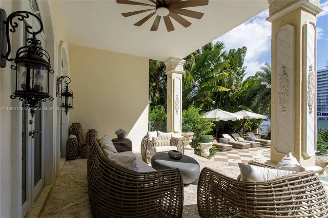a view of a swimming pool with outdoor seating