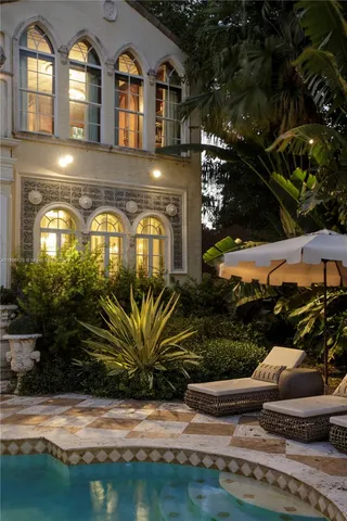 an aerial view of a house with outdoor space swimming pool and outdoor seating