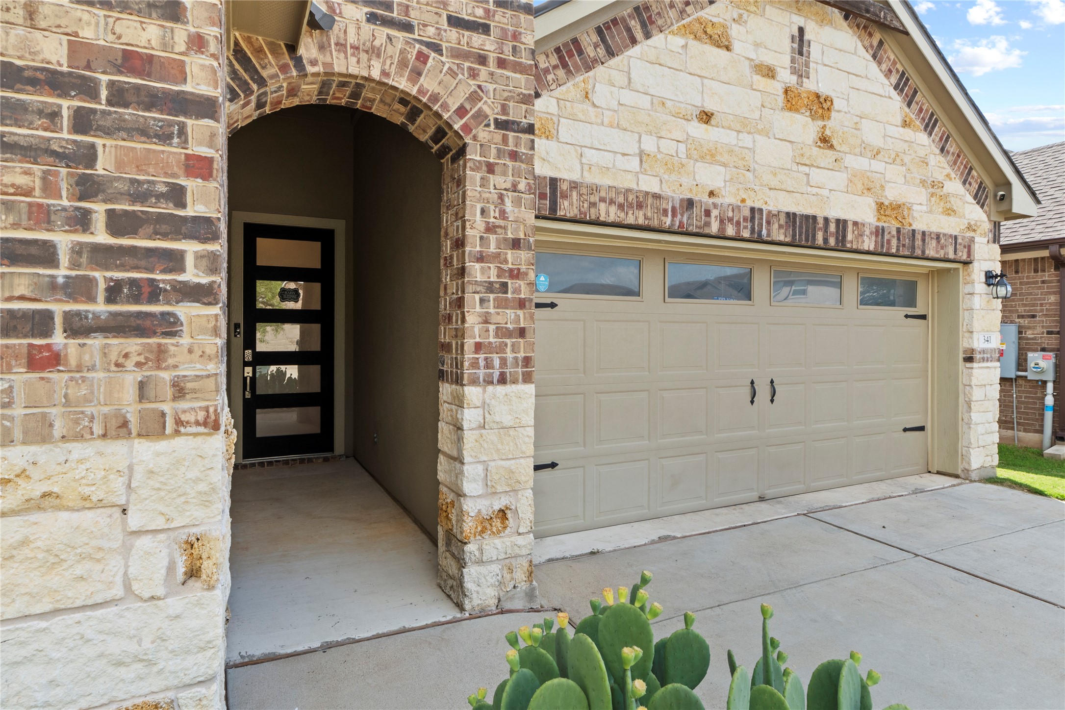 341 Peace Pipe Way Georgetown, TX 78628 - Photo 4 of 28 Beautiful combination of brick and stone on this front elevation