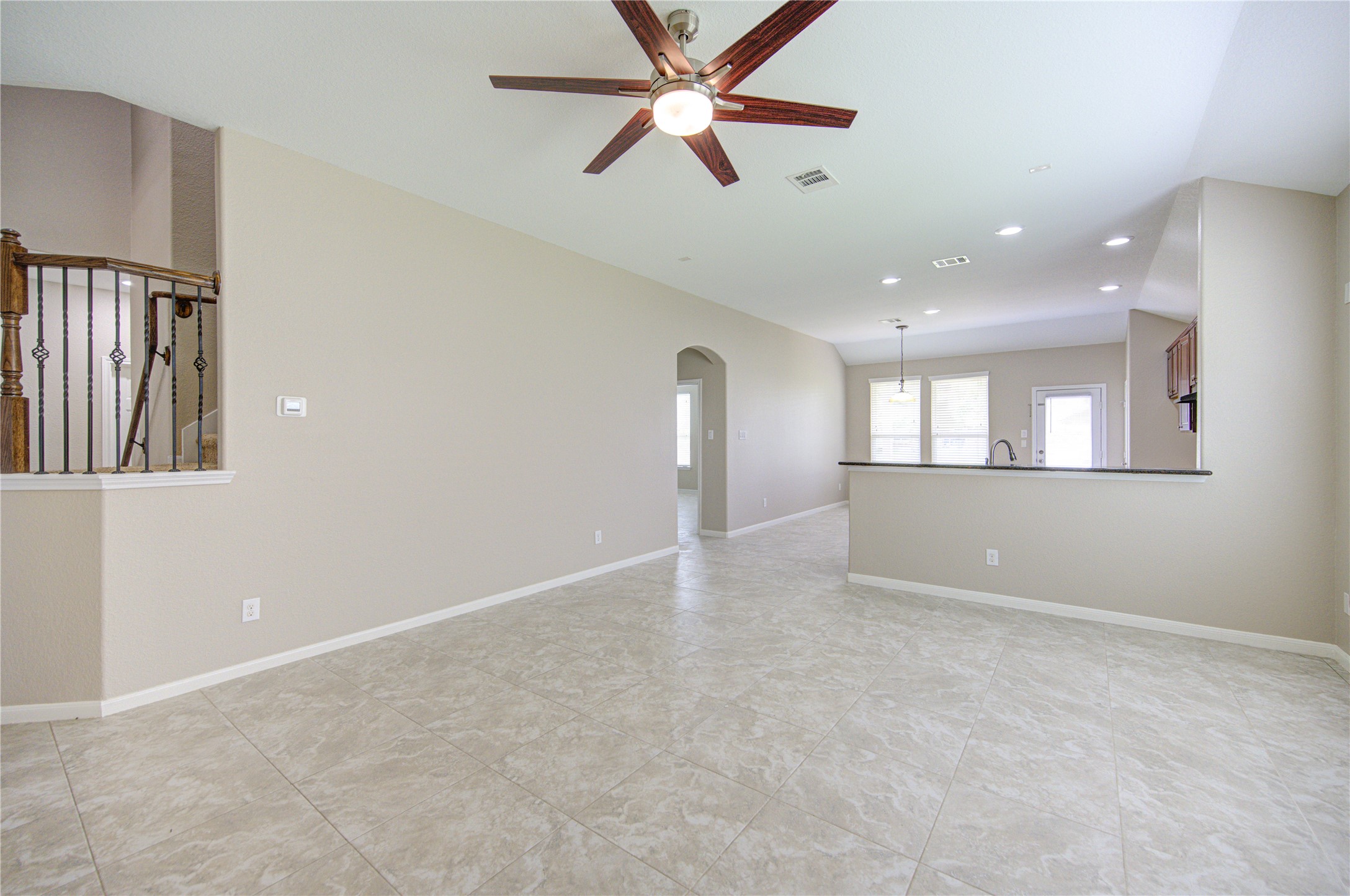 6014 Watford Bend Rosenberg, TX 77471 - Photo 2 of 18 03 – Spacious living room with natural light and views into the kitchen.
