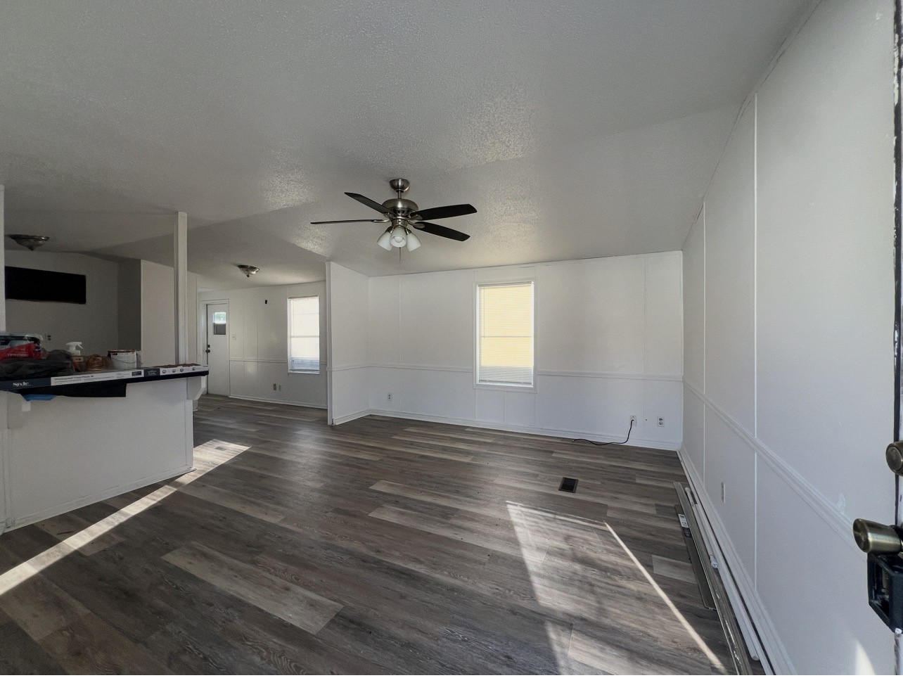 1511-4 Jones Street, Unit 4 Rosenberg, TX 77471 - Photo 4 of 11 a view of empty room with wooden floor and fan