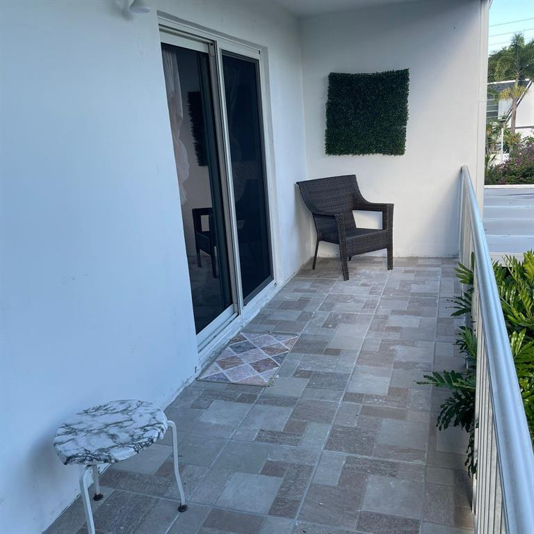 6728 Southwest 40th Street, Unit 6728 Fort Lauderdale, FL 33314 - Photo 11 of 13 a view of a livingroom with furniture and a flat screen tv