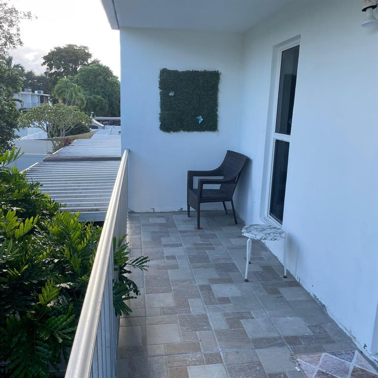 6728 Southwest 40th Street, Unit 6728 Fort Lauderdale, FL 33314 - Photo 10 of 13 a backyard of a house with seating space