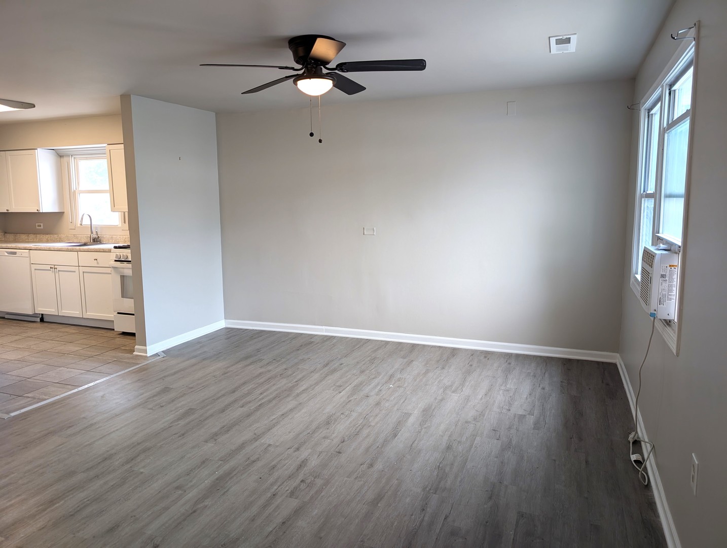 950 North Brainard Street Naperville, IL 60563 - Photo 9 of 9 wooden floor in an empty room with a window