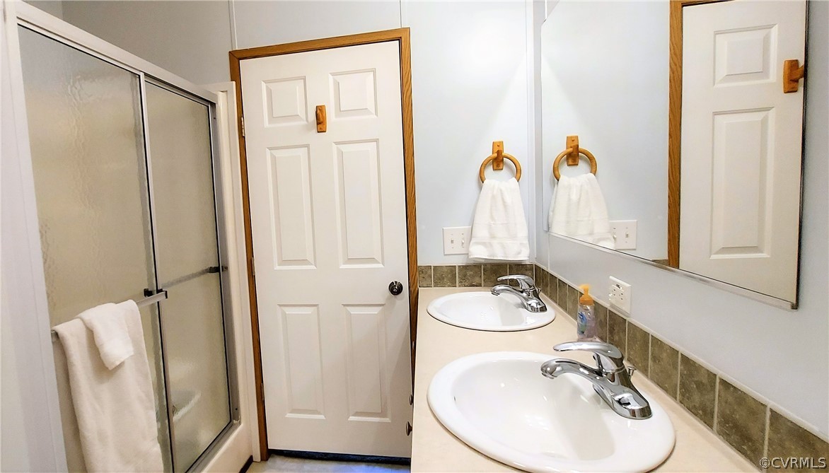 1722 Mallory Road Kents Store, VA 23084 - Photo 19 of 37 a bathroom with a sink a toilet and a mirror