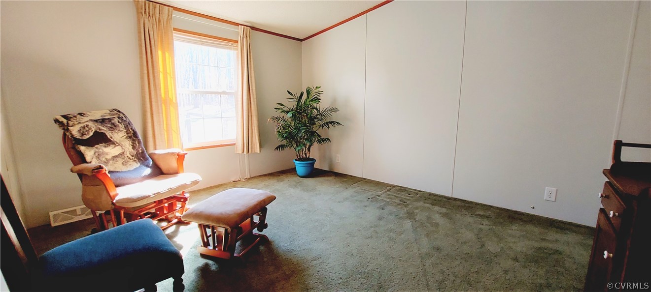 1722 Mallory Road Kents Store, VA 23084 - Photo 23 of 37 a living room with furniture and a window