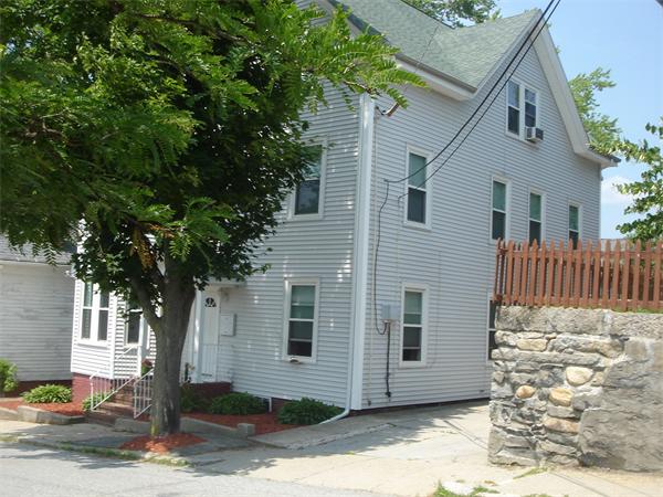 231 Cato Street Woonsocket, RI 02895 - Photo 12 of 15 a front view of a house with a tree