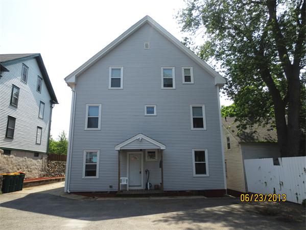 231 Cato Street Woonsocket, RI 02895 - Photo 13 of 15 a front view of a house with a yard