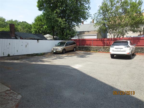 231 Cato Street Woonsocket, RI 02895 - Photo 15 of 15 a car parked in front of a house