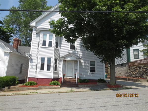 231 Cato Street Woonsocket, RI 02895 - Photo 3 of 15 a view of a white house with large windows and a tree