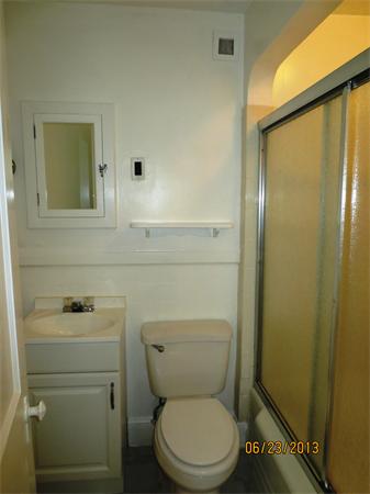 231 Cato Street Woonsocket, RI 02895 - Photo 7 of 15 a bathroom with a toilet a sink and mirror