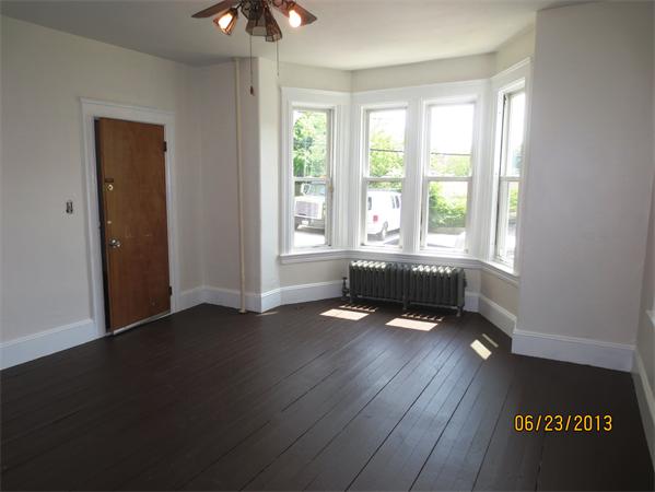 231 Cato Street Woonsocket, RI 02895 - Photo 9 of 15 a living room with hardwood floor and a ceiling fan