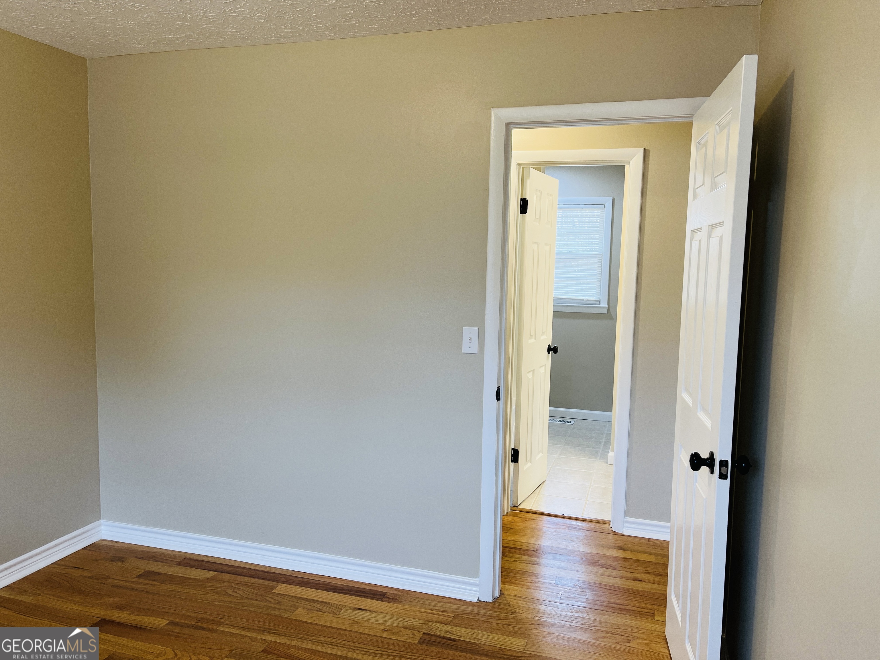 1085 Horsley Mill Road Carrollton, GA 30116 - Photo 16 of 26 a view of a room with wooden floor