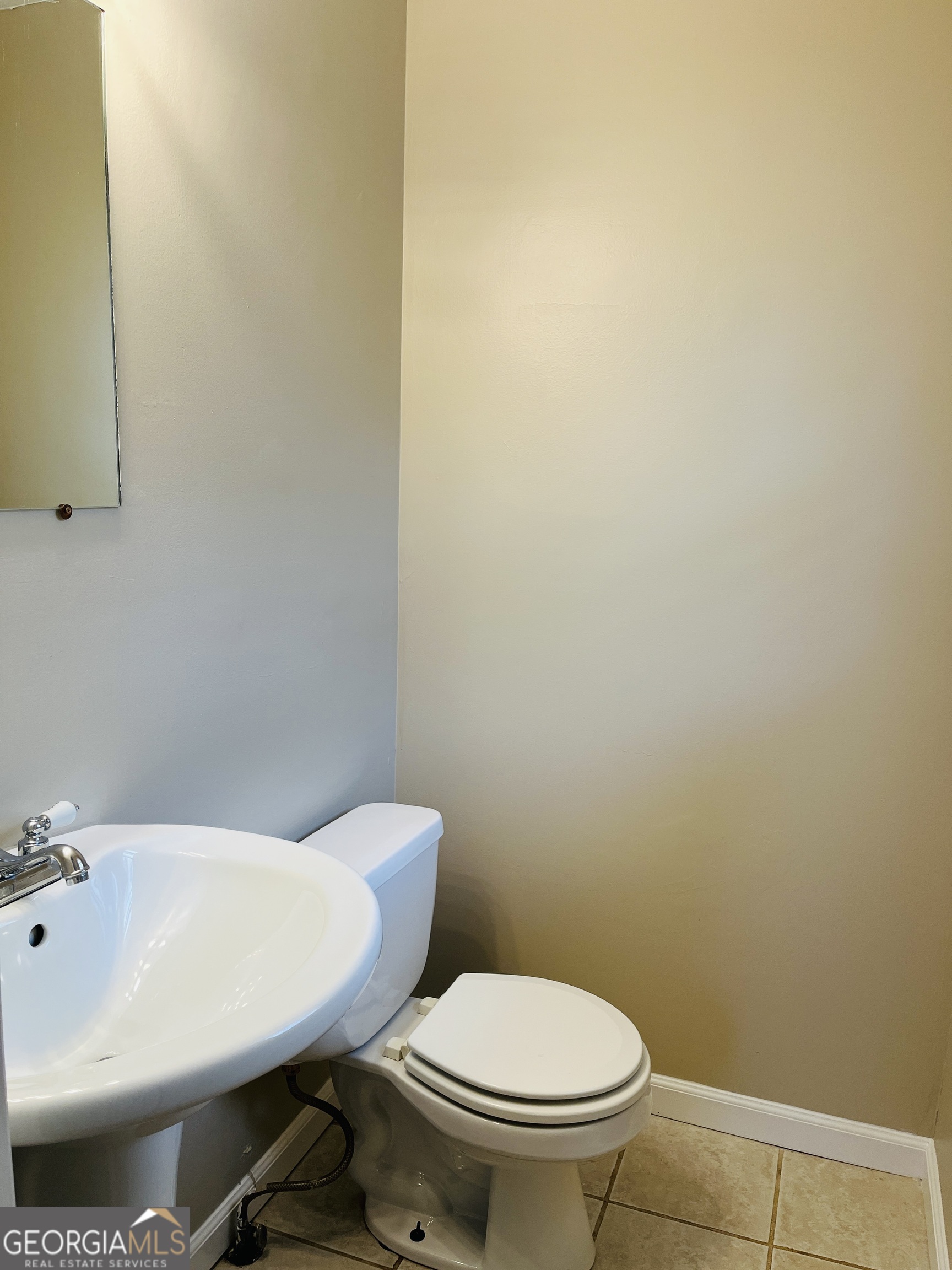 1085 Horsley Mill Road Carrollton, GA 30116 - Photo 22 of 26 a bathroom with a sink and a toilet